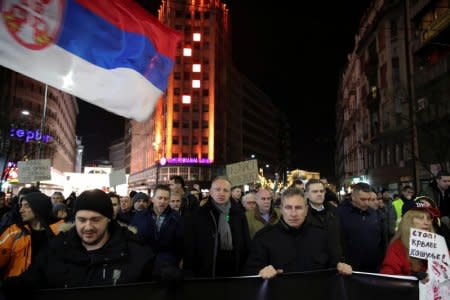 Demonstrators walk along a street during an anti-government protest in central Belgrade, Serbia, December 8, 2018. REUTERS/Marko Djurica