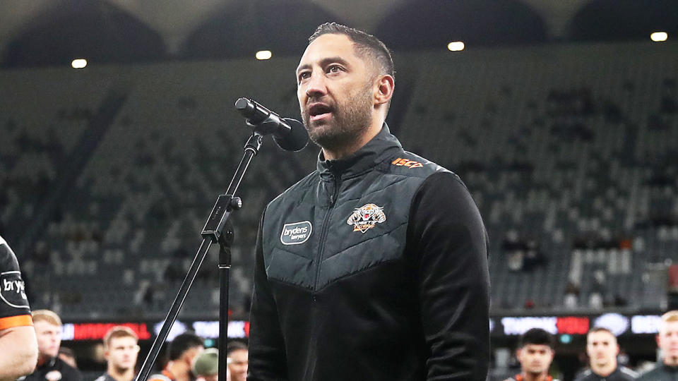 Benji Marshall (pictured) speaks to the crowd after playing in his last game for the Tigers.