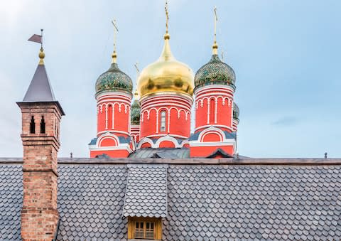 The Old English Court sticks out against the onion-domed churches of Moscow's skyline - Credit: GETTY