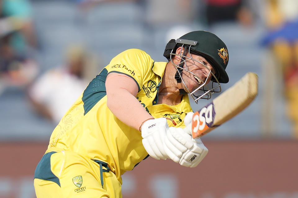 Australia's David Warner plays a shot during the ICC Men's Cricket World Cup match between Australia and Bangladesh in Pune, India, Saturday, Nov. 11, 2023. (AP Photo/Rafiq Maqbool)