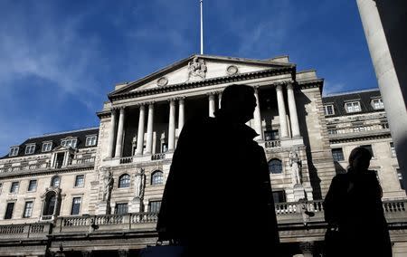 Pedestrians walk past the Bank of England in London March 5, 2015. REUTERS/Suzanne Plunkett