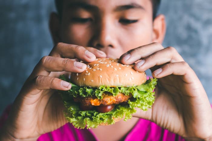 A man holding a sandwich