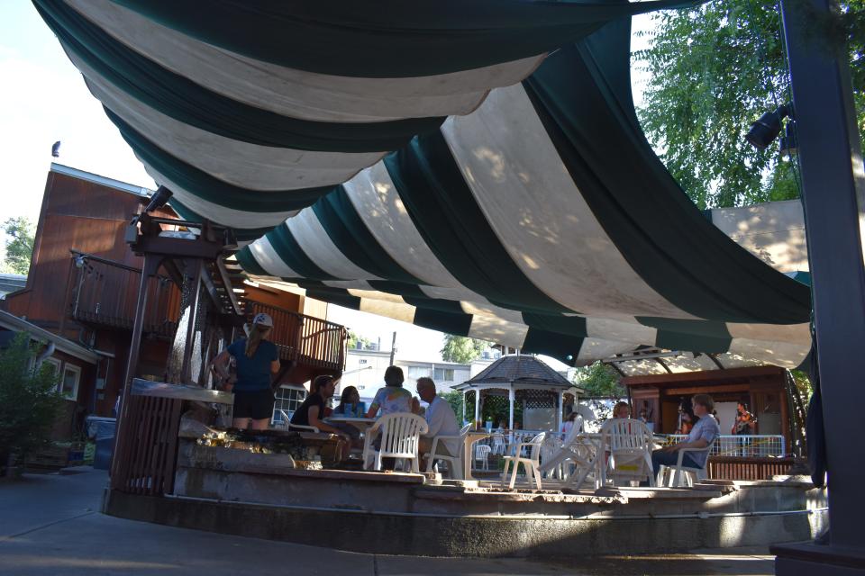 Avogadro's Number boasts an expansive back patio with a stage for live music, large shade sails, a gazebo and tree house.