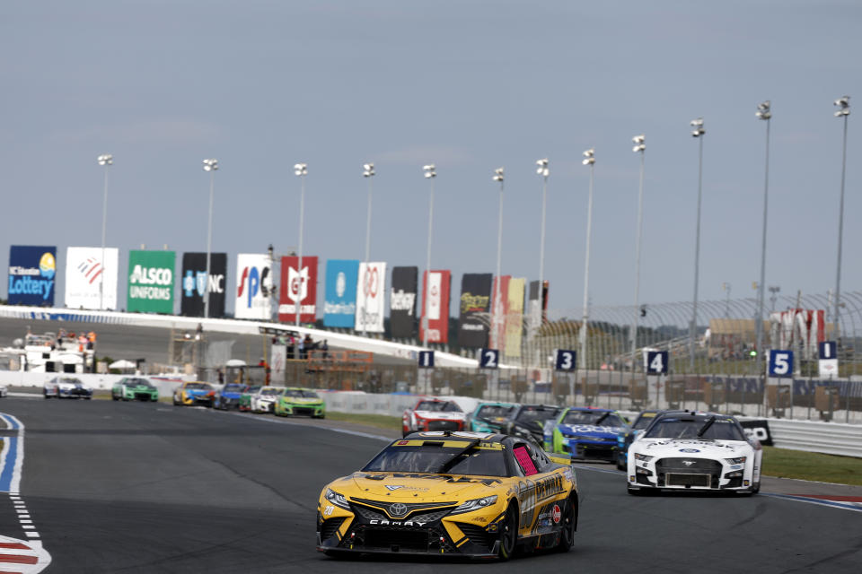 CONCORD, NORTH CAROLINA - OCTOBER 09: Christopher Bell, driver of the #20 DeWalt Toyota, leads a pack of cars during the NASCAR Cup Series Bank of America Roval 400 at Charlotte Motor Speedway on October 09, 2022 in Concord, North Carolina. (Photo by Jared C. Tilton/Getty Images)