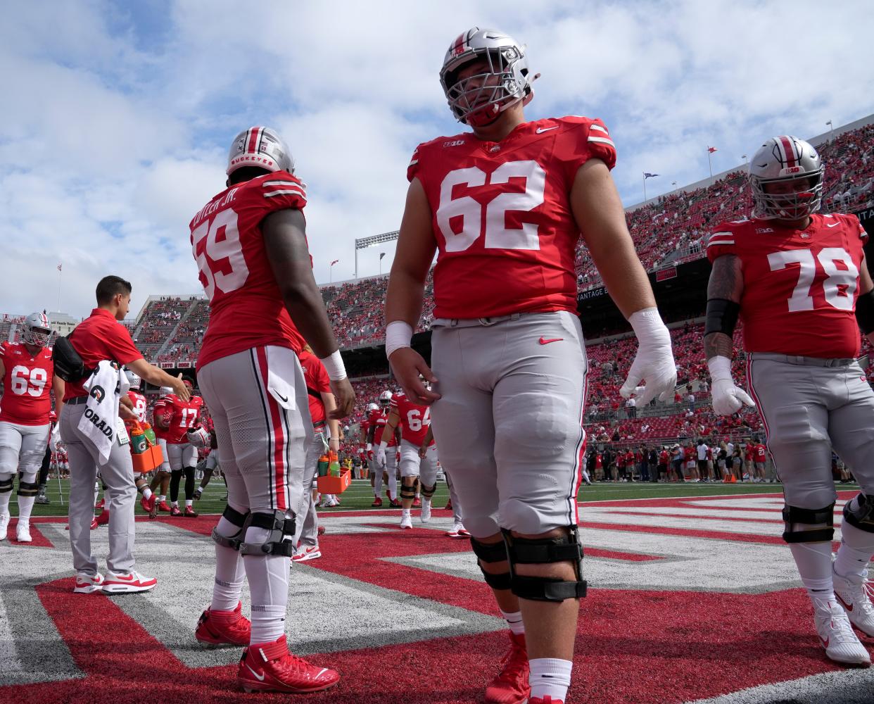 Sept. 9, 2023; Columbus, Oh., USA;  Ohio State Buckeyes offensive lineman Victor Cutler Jr. (59), Ohio State Buckeyes offensive lineman Joshua Padilla (62) and Ohio State Buckeyes offensive lineman Jakob James (78) warm up before Saturday's NCAA Division I football game between the Ohio State Buckeyes and the Youngstown State Penguins at Ohio Stadium. 