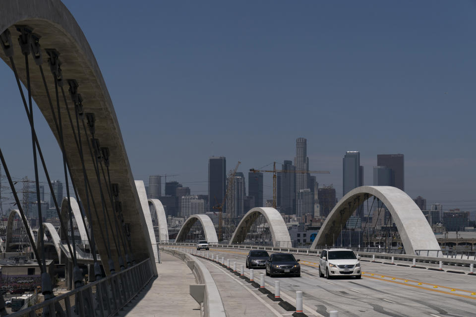 Cars move along the 6th Street Viaduct in Los Angeles, Wednesday, July 27, 2022. The newest bridge in Los Angeles, a $588-million architectural marvel with views of the downtown skyline, opened to great fanfare on July 10. It has already been closed, to great dismay, several times since then amid chaos and collisions. (AP Photo/Jae C. Hong)