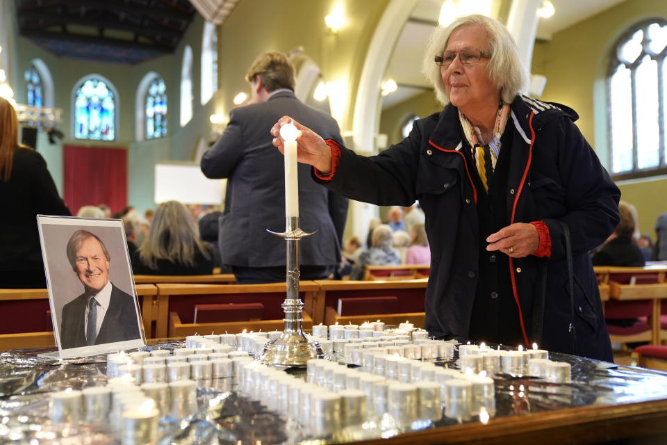 People light candles during a vigil at St Michael & All Angels church in Leigh-on-Sea in Essex for Conservative MP Sir David Amess who died after he was stabbed several times at a constituency surgery on Friday. Picture date: Sunday October 17, 2021.