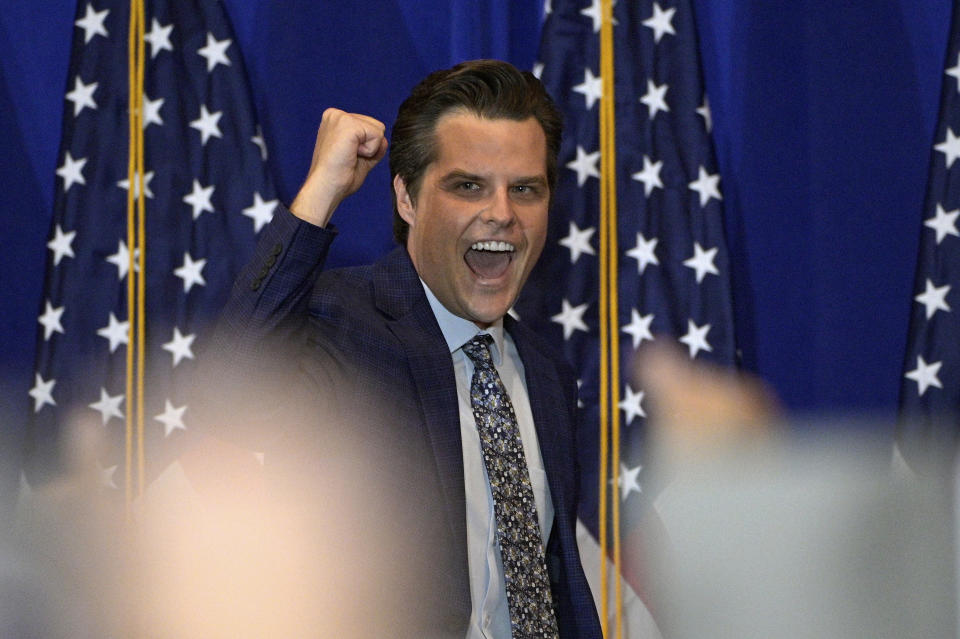 Rep. Matt Gaetz, R-Fla., cheers with attendees of a rally featuring himself and Rep. Marjorie Taylor Greene, R-Ga., Friday, May 7, 2021, in The Villages, Fla. (AP Photo/Phelan M. Ebenhack)