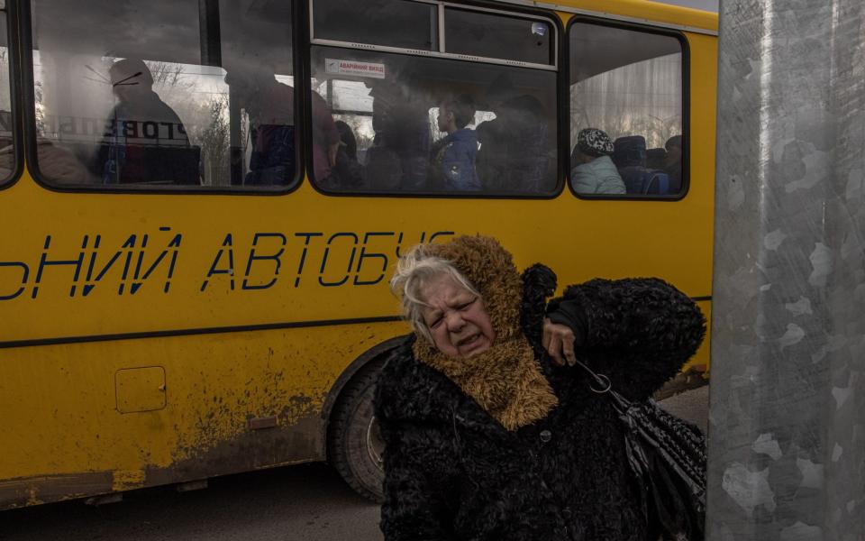 People from Mariupol arrive on an evacuation bus in Zaporizhzhia, Ukraine, 21 April 2022. - Roman Pilipey/Shutterstock