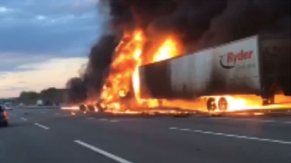 The two trucks continued to explode next to the two Australian's who were risking their lives to save a US truck driver. Photo: Supplied