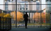 A man stands inside the Paul Loebe building ahead of the arrival of Wirecard's former boss Markus Braun, in Berlin