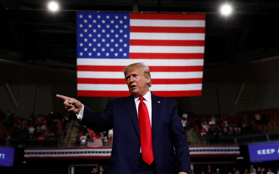 Donald Trump at a rally last week - AP