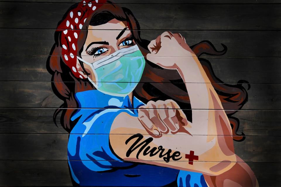 TEXAS: A Rosie the Riveter-inspired mural on a wall near a hospital in Dallas pays tribute to nurses on April 7.