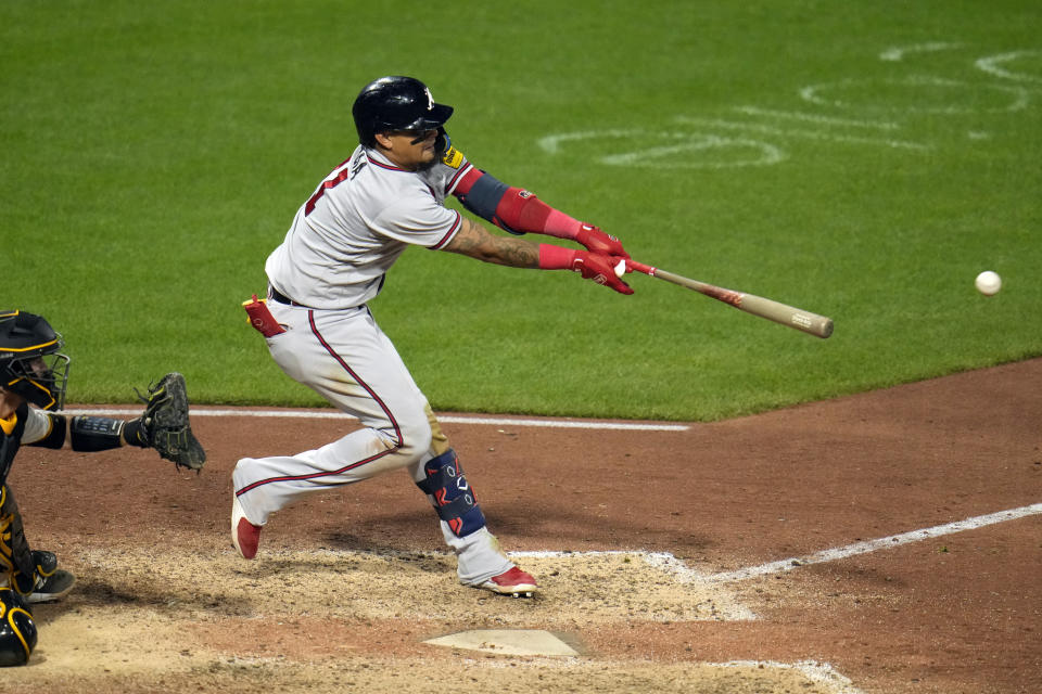 Atlanta Braves' Orlando Arcia doubles off Pittsburgh Pirates relief pitcher David Bednar, driving in two runs, during the ninth inning of a baseball game in Pittsburgh, Tuesday, Aug. 8, 2023. The Braves won 8-6. (AP Photo/Gene J. Puskar)