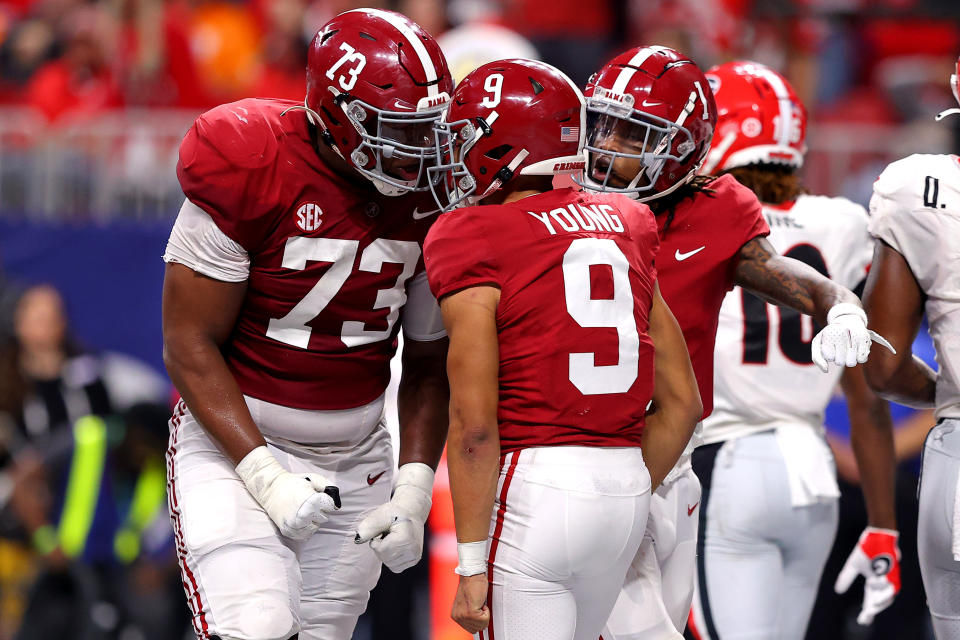 Bryce Young (9) of the Alabama Crimson Tide reacts after scoring a touchdown with teammate Evan Neal (73) in the second quarter of the SEC championship. (Kevin C. Cox/Getty Images)