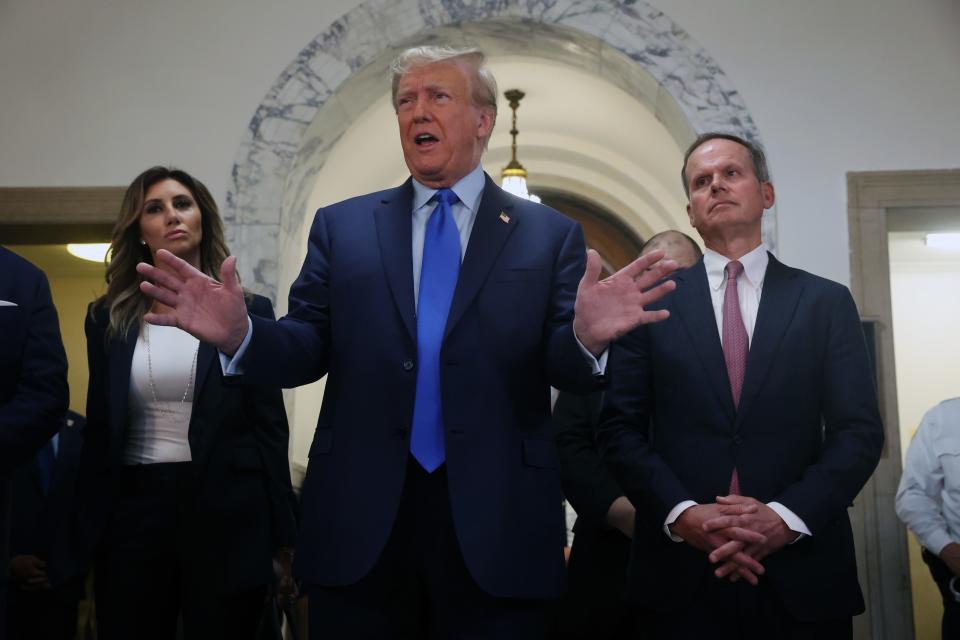 Former President Donald Trump speaks to the media as he arrives at New York State Supreme Court to start the civil fraud trial against him on Oct. 2, 2022 in New York City. Former President Trump may be forced to sell off his properties after Justice Arthur Engoron canceled his business certificates and ruled that he committed fraud for years while building his real estate empire after being sued by Attorney General Letitia James, seeking $250 million in damages. The trial will determine how much he and his companies will be penalized for the fraud.