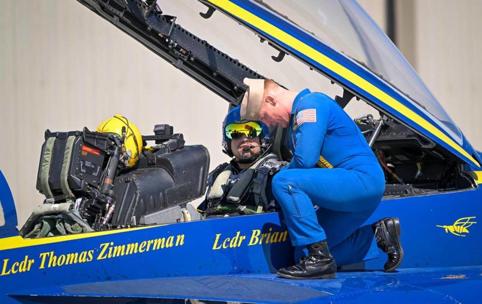 U.S. Navy Lt. Cmdr. Thomas Zimmerman, pilot, spoke with Erik Erazo, who was buckled in for a flight on the Blue Angels jet on Wednesday, Aug. 16, 2023, at New Century AirCenter in Gardner, Kansas. Erazo, an Olathe school district administrator who founded the district’s lowrider bike club, was selected as the Key Influencer for the 2023 Garmin KC Air Show was honored with a flight in an F/A 18 Super Hornet. “I only passed out once,” said Earzo, who briefly passed out when the aircraft hit 7 G’s. Tammy Ljungblad/tljungblad@kcstar.com