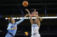 UCLA guard Kiki Rice (1) shoots over Creighton forward Mallory Brake (14) during the second half of a second-round college basketball game in the women's NCAA Tournament Monday, March 25, 2024, in Los Angeles. (AP Photo/Marcio Jose Sanchez)