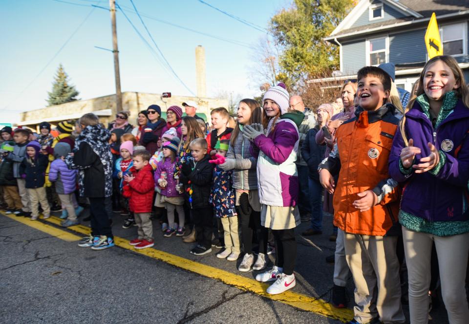 "Cut that tree, cut that tree," school kids chant during a special tree-cutting ceremony celebrating the harvest of the state's 2022 official Christmas tree, Friday, Oct. 28, 2022, in St. Johns.