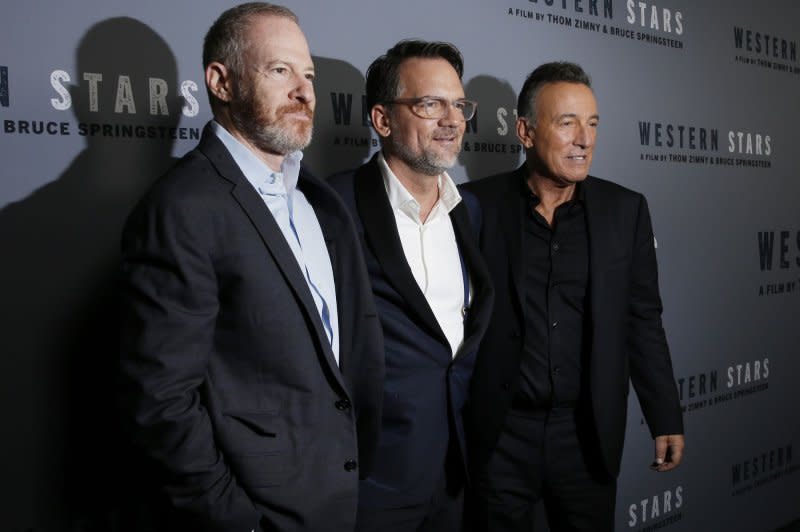 Left to right, chairman of Warner Bros. Pictures Group Toby Emmerich, film editor Thom Zimny and Bruce Springsteen arrive on the red carpet at the New York special screening of "Western Stars" at Metrograph in New York City in 2019. File Photo by John Angelillo/UPI