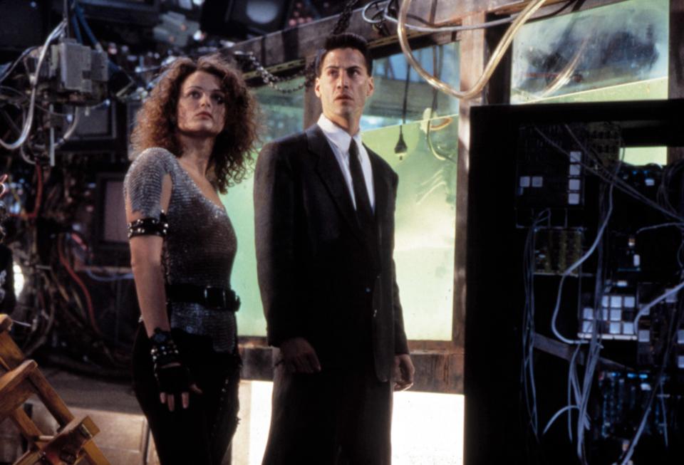 <h1 class="title">JOHNNY MNEMONIC, Dina Meyer, Keanu Reeves, 1995</h1><cite class="credit">©TriStar Pictures/Courtesy Everett Collection</cite>