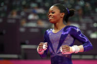 LONDON, ENGLAND - JULY 29: Gabrielle Douglas of the United States smiles after she competes in the uneven bars in the Artistic Gymnastics Women's Team qualification on Day 2 of the London 2012 Olympic Games at North Greenwich Arena on July 29, 2012 in London, England. (Photo by Ronald Martinez/Getty Images)