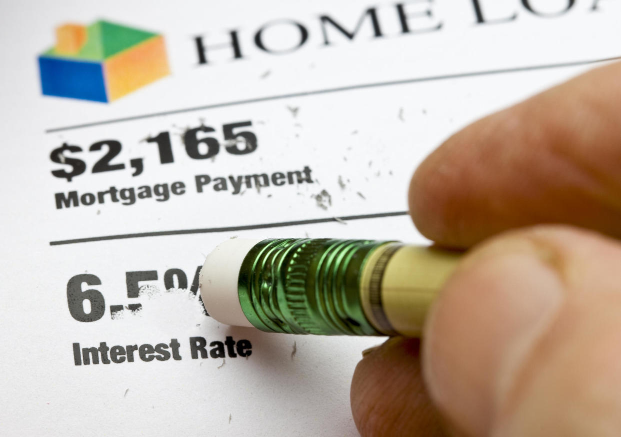 Here's a step-by-step guide to finding and locking in the lowest possible mortgage interest rates - and what to keep in mind along the way. / Credit: Bill Oxford/Getty Images