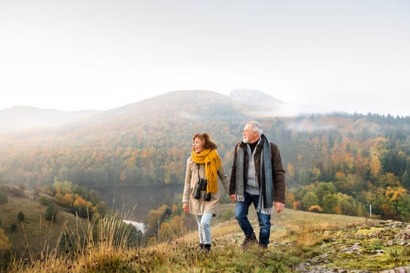 Senior couple hiking in beautiful mountains.