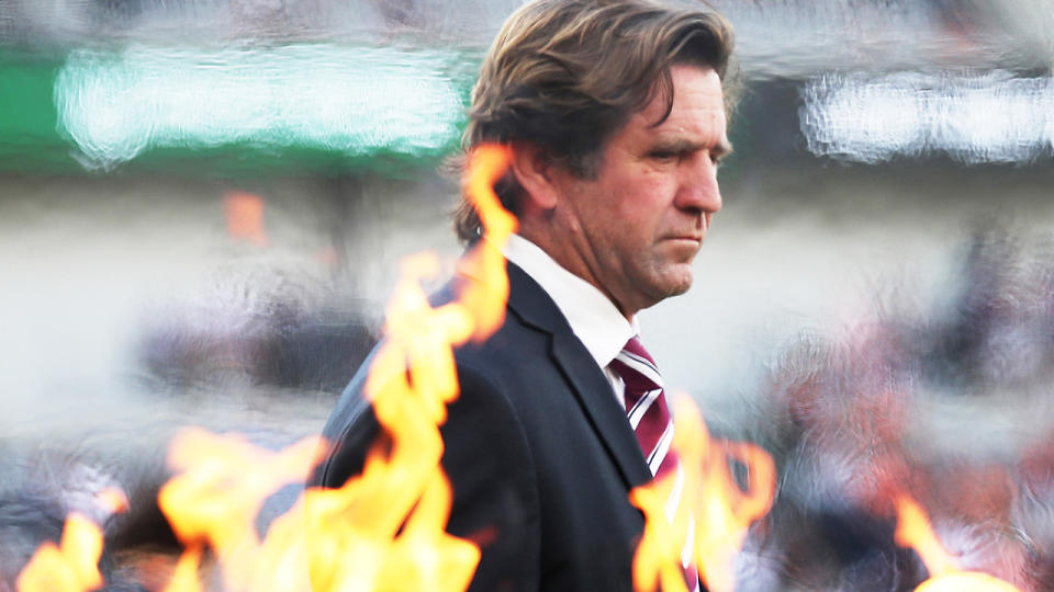 Manly coach Des Hasler is pictured walking onto the ground before an NRL game.