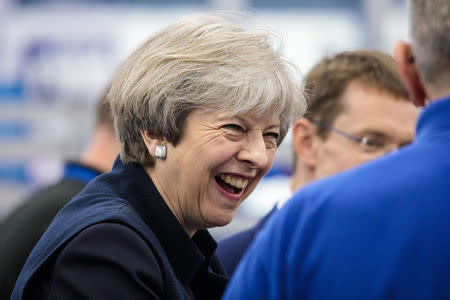 Britain's Prime Minister Theresa May and West Midlands Mayor Andy Street (unseen) tour the UTC Aerospace Systems factory during a campaign visit on May 6, 2017 in Wolverhampton. REUTERS/Jack Taylor/Pool