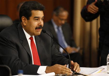 Venezuela's President Nicolas Maduro speaks during a meeting with representatives of the opposition, the Roman Catholic Church and Union of South American Nations' (UNASUR) at Miraflores Palace in Caracas April 10, 2014. REUTERS/Carlos Garcia Rawlins