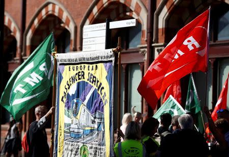 Striking Eurostar train managers and members of the RMT union stand together on a picket line outside St. Pancras train station in London, Britain August 12, 2016. REUTERS/Peter Nicholls