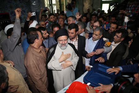 Iranian presidential candidate Ebrahim Raisi gestures as he casts his vote during the presidential election in Tehran, Iran, May 19, 2017. TIMA via REUTERS