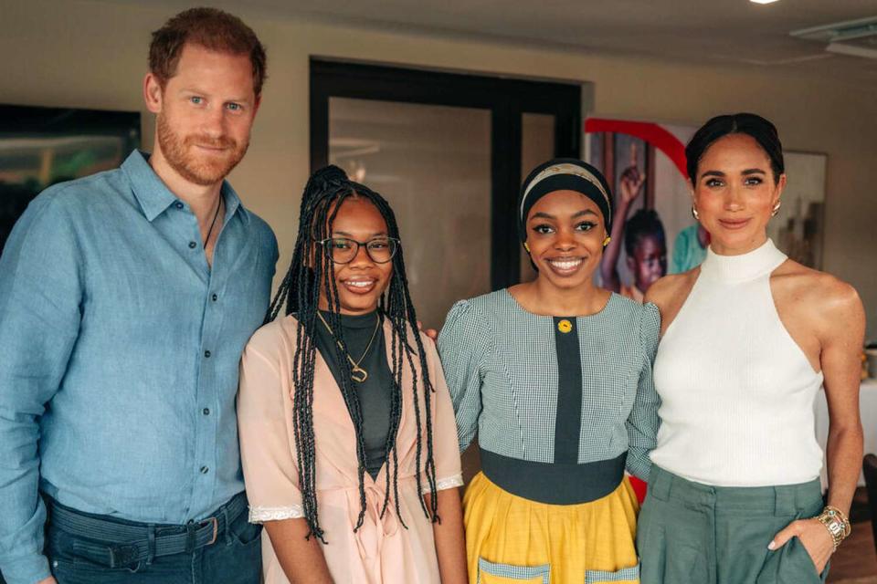 <p>Musa Pem/Save the Children</p> Prince Harry (left) and Meghan Markle (right) pose with Save the Children Youth Ambassadors Purity and Maryam in Abuja, Nigeria, in May 2024.