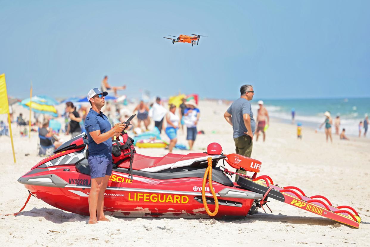 Man flies drone at beach