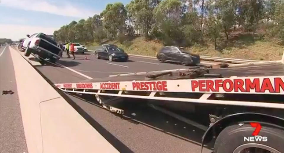 A ute driver allegedly drove 13 kilometres on the wrong side of a busy Sydney motorway into oncoming traffic before he crashed. Source: 7 News