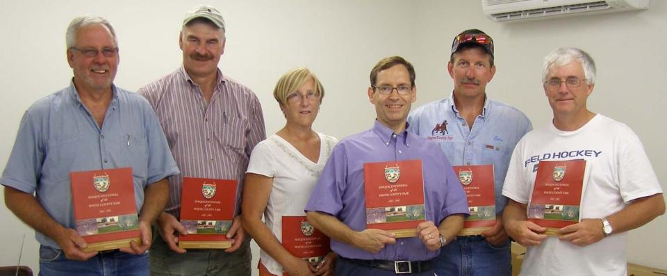 The Wayne County Fair has published a history book to commemorate 150 years since the Fair north of Honesdale was founded in 1862. Fair Book Committee members are shown, from left: Dave Gellatt Jr., John Whetmore, Diane Mott, the book’s author Peter Becker, Eric Kowalczyk and Jeff Firmstone. Absent from picture: Nina Martin, Judy Muller and Kathryn Dix. The 150th Wayne County Fair is set, August 3-11. Books will be available at a souvenir booth under the grandstand, at Honesdale National Bank and the Wayne County Visitor’s Center.