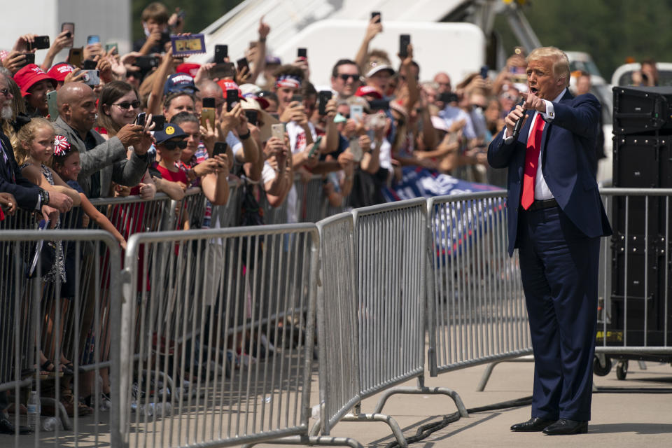 President Donald Trump talks to a crowd of supporters after arriving at Wilmington International Airport, Wednesday, Sept. 2, 2020, in Wilmington, N.C. (AP Photo/Evan Vucci)