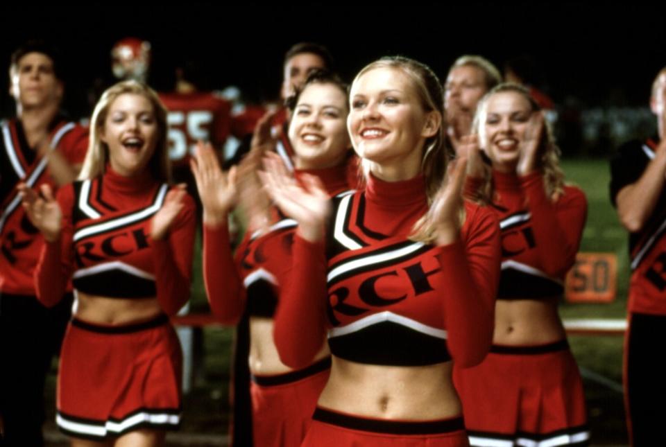 In “Bring It On,” Dunst stars as the captain of the Toro cheerleading squad as they compete against the Clovers for the top prize at the Daytona Beach, Florida, cheer competition.
