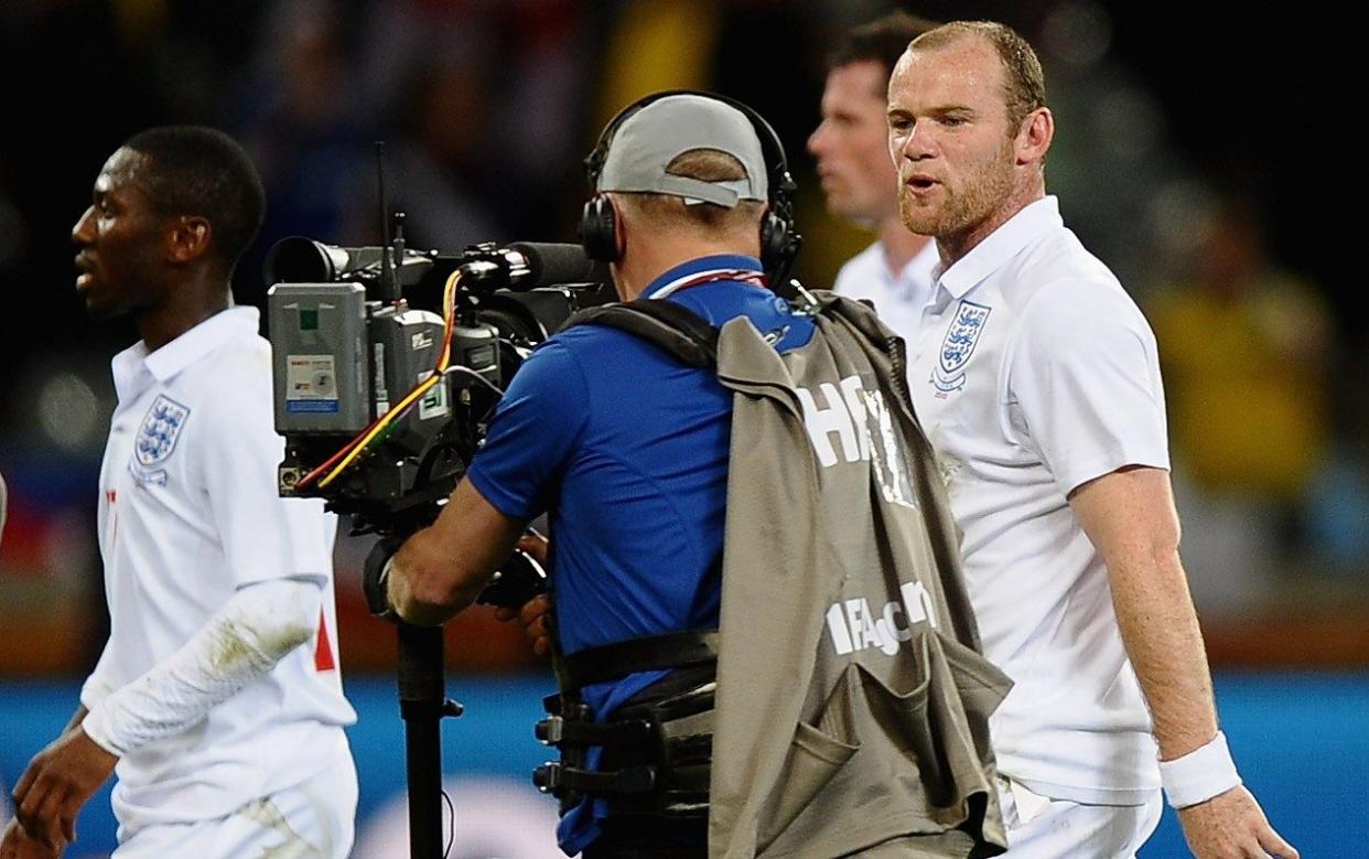 Wayne Rooney of England speaks to a cameraman
