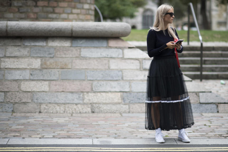 Charlotte Groeneveld’s sheer maxi skirt adds witchy allure (that’s a good thing, obviously) to a basic black sweater and sneaks.