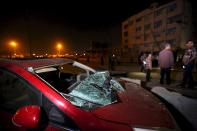 A damaged car is seen at the site of a bomb blast at a national security building in Shubra Al-Khaima on the outskirts of Cairo, Egypt August 20, 2015. At least six people were wounded early on Thursday in the car bombing near the state security building and courthouse in the Cairo suburb, security sources said. (REUTERS/Mohamed Abd El Ghany)