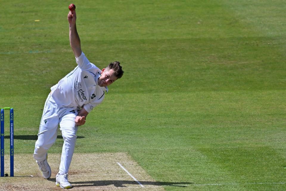 Ireland's Curtis Campher bowls during play on day 2 of the Test match between England and Ireland at the Lord's cricket ground in London, on June 2, 2023 - Getty Images/Glyn Kirk