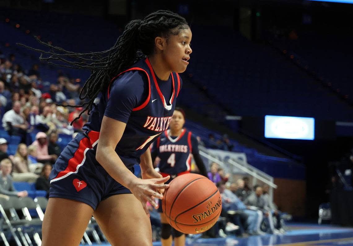 Sacred Heart’s ZaKiyah Johnson (11) drives to the hoop during the Girls’ Sweet 16 in Rupp Arena last March. Johnson and Sacred Heart went 36-3 last season and won the state title. James Crisp