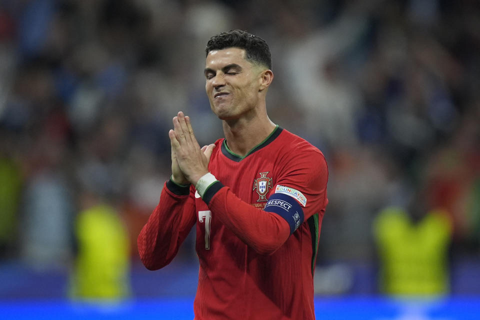 Portugal's Cristiano Ronaldo reacts after scoring in penalties shootouts during a round of sixteen match between Portugal and Slovenia at the Euro 2024 soccer tournament in Frankfurt, Germany, Monday, July 1, 2024. (AP Photo/Matthias Schrader)