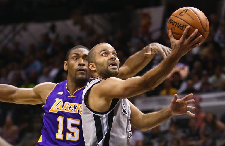 Tony Parker (R) of the San Antonio Spurs takes a shot during the game against the Los Angeles Lakers on April 24, 2013. Parker scored 28 points to spark the host Spurs over the Los Angeles Lakers 102-91