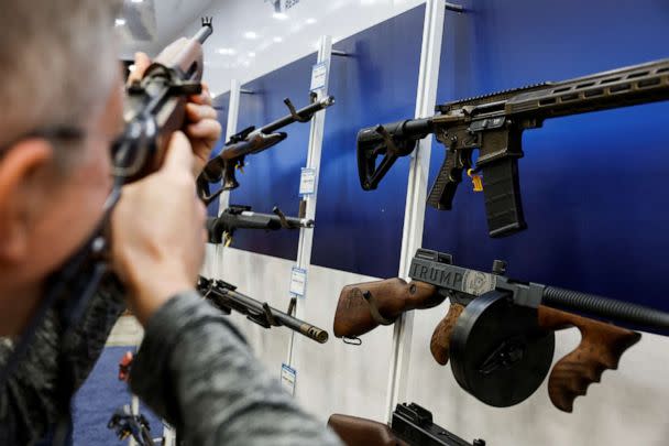 PHOTO: A man tries out a rifle at the National Rifle Association (NRA) annual convention in Indianapolis, Indiana, U.S., April 14, 2023. (Evelyn Hockstein/Reuters)