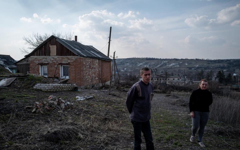 BOHORODYCHNE, UKRAINE - MARCH 24: 37 year-old Eugene (L) and 44 year-old Olga (R) are seen in front of their home as daily life continues under difficult conditions amid Russia-Ukraine war in the village of Bohorodychne of Donetsk Oblast, Ukraine on March 24, 2023. The village of Bohorodychne in the Donetsk Oblast of eastern Ukraine was one of the frontlines of the war in June and was under control of Russian forces in August until it was liberated by Ukrainian forces in September 2022. (Photo by Wolfgang Schwan/Anadolu Agency via Getty Images) - Wolfgang Schwan/Anadolu Agency via Getty Images