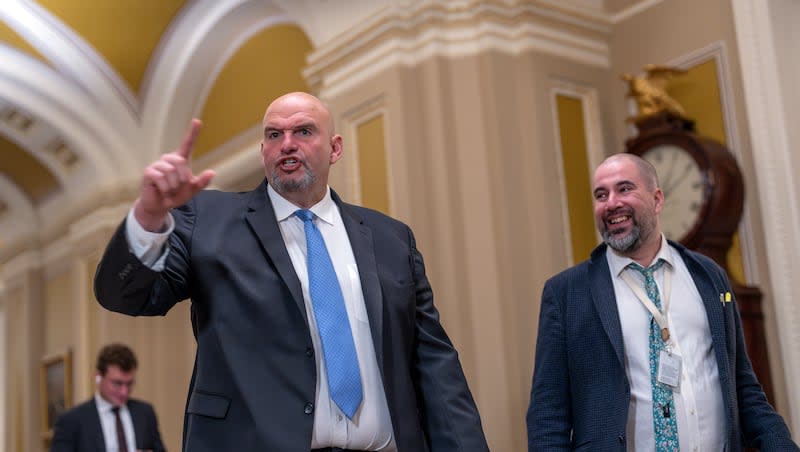 Sen. John Fetterman, D-Pa., talks with reporters as the Senate convenes for the impeachment trial of Homeland Security Secretary Alejandro Mayorkas brought by House Republicans over his handling of the U.S.-Mexico border, at the Capitol in Washington, Wednesday, April 17, 2024. Fetterman said he would like to see Sen. Mitt Romney, R-Utah, as the next president of Harvard University.