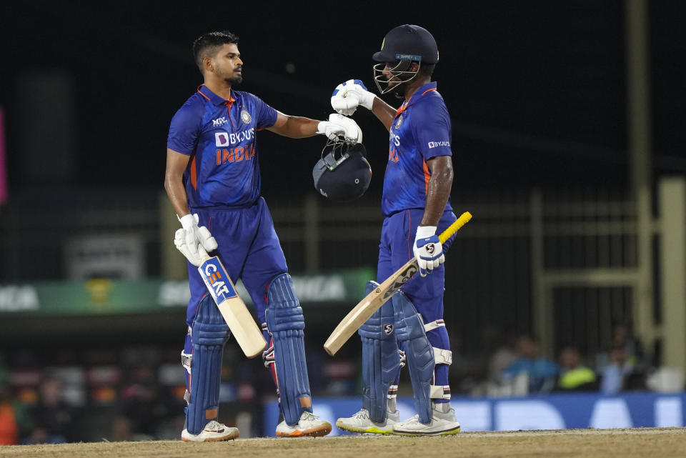 India's Shreyas Iyer, left, celebrates with teammate by Sanju Samson after their win in the second one day international cricket match between India and South Africa, in Ranchi , India, Sunday, Oct. 9, 2022. (AP Photo/Mahesh Kumar A.)